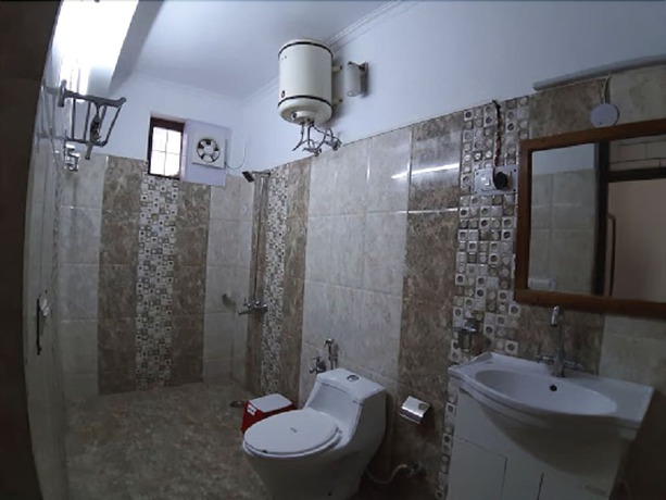 Imagen de la habitación del Hotel SN Residency. Foto 5