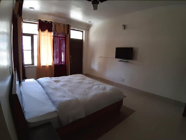 Imagen de la habitación del Hotel SN Residency. Foto 9