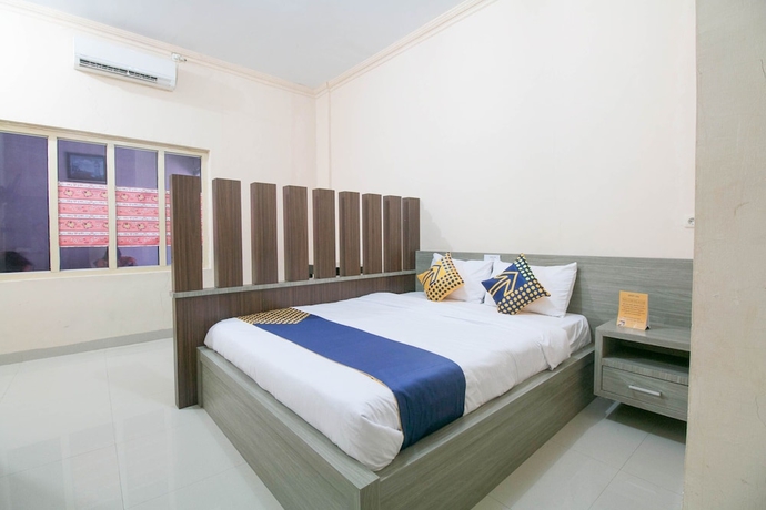 Imagen de la habitación del Hotel SPOT ON 1968 Grand Azizah. Foto 6