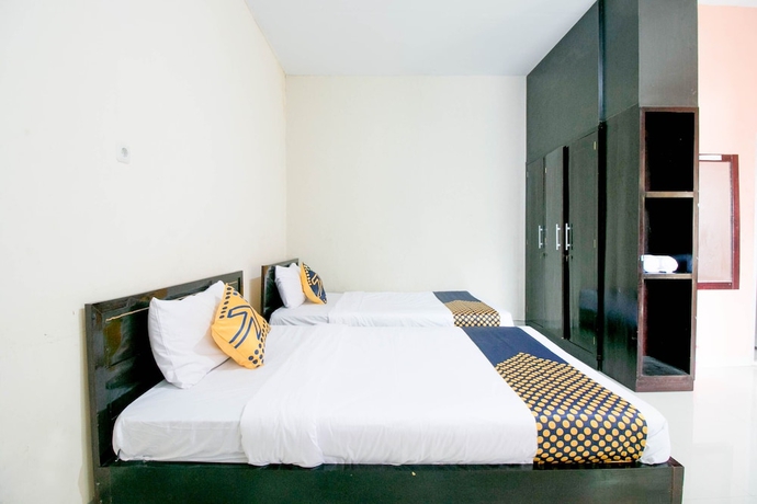 Imagen de la habitación del Hotel SPOT ON 1968 Grand Azizah. Foto 8