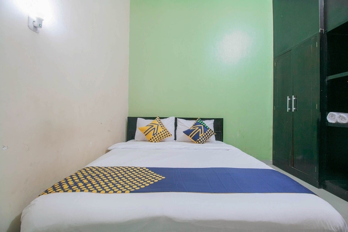 Imagen de la habitación del Hotel SPOT ON 1968 Grand Azizah. Foto 9