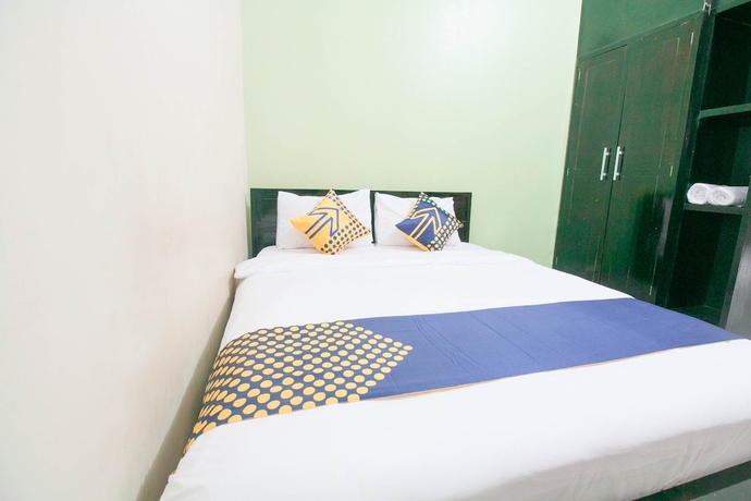 Imagen de la habitación del Hotel SPOT ON 1968 Grand Azizah. Foto 11