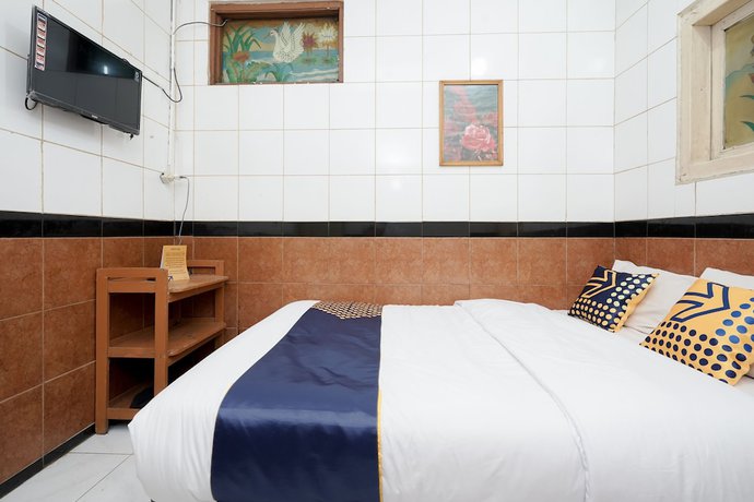 Imagen de la habitación del Hotel SPOT ON 2054 Arimbi 3. Foto 6
