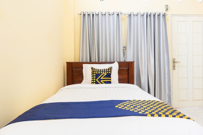 Imagen de la habitación del Hotel SPOT ON 2063 Bethania Residence. Foto 4