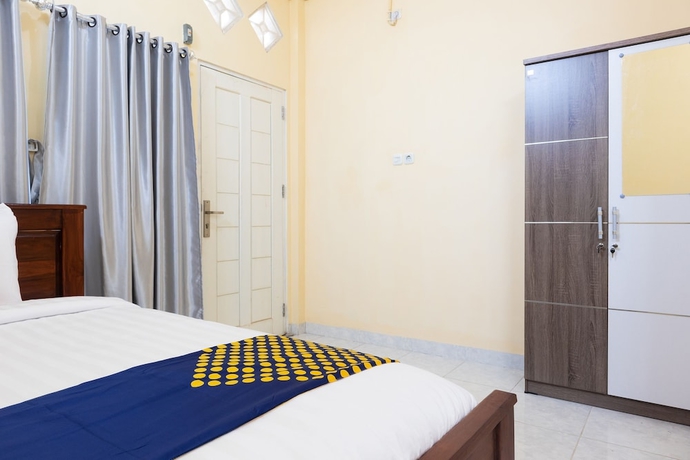 Imagen de la habitación del Hotel SPOT ON 2063 Bethania Residence. Foto 8