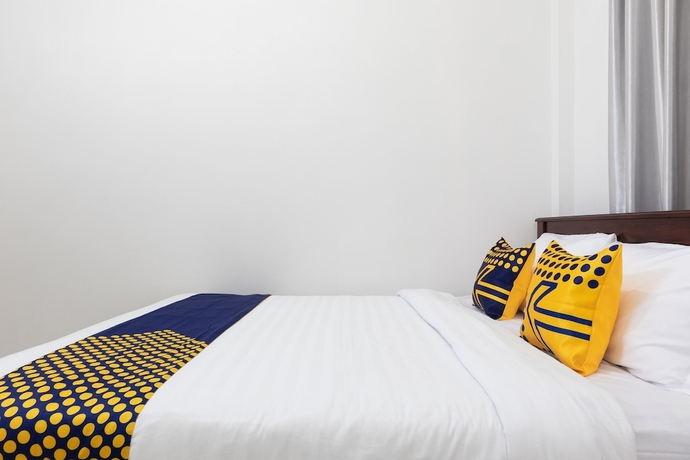 Imagen de la habitación del Hotel SPOT ON 2063 Bethania Residence. Foto 10