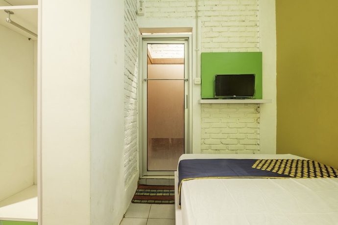 Imagen de la habitación del Hotel SPOT ON 2080 Rumah Kita Residence. Foto 7
