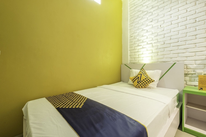 Imagen de la habitación del Hotel SPOT ON 2080 Rumah Kita Residence. Foto 8