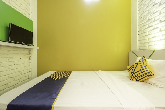 Imagen de la habitación del Hotel SPOT ON 2080 Rumah Kita Residence. Foto 9