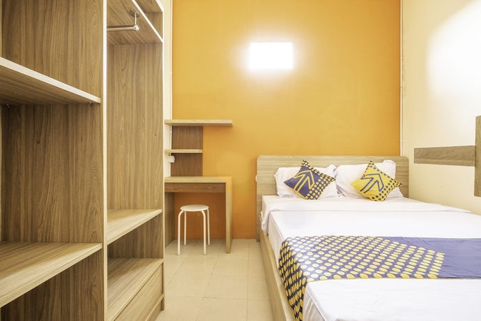 Imagen de la habitación del Hotel SPOT ON 2080 Rumah Kita Residence. Foto 10