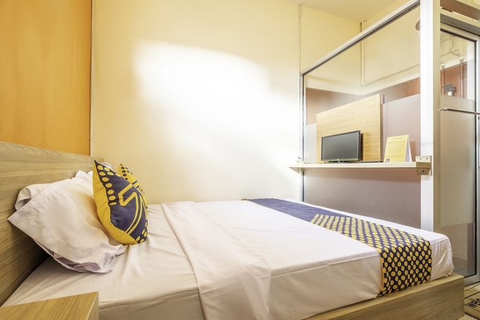 Imagen de la habitación del Hotel SPOT ON 2080 Rumah Kita Residence. Foto 11