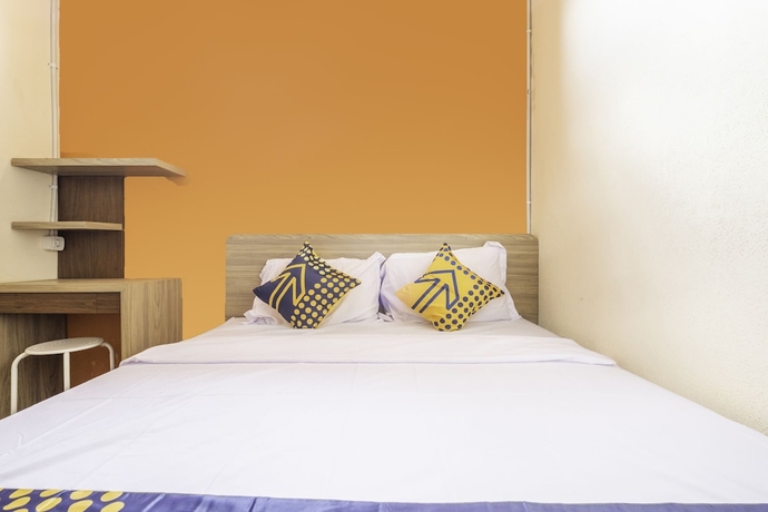 Imagen de la habitación del Hotel SPOT ON 2080 Rumah Kita Residence. Foto 14