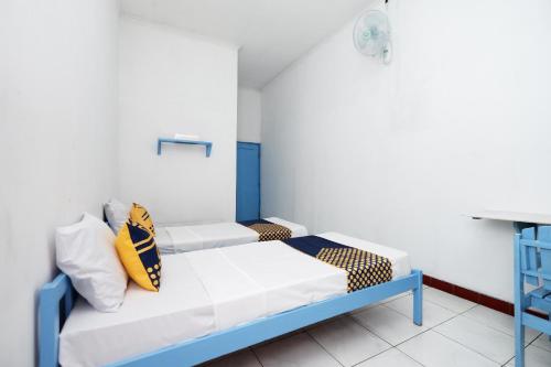 Imagen de la habitación del Hotel SPOT ON 2289 Saudara. Foto 8