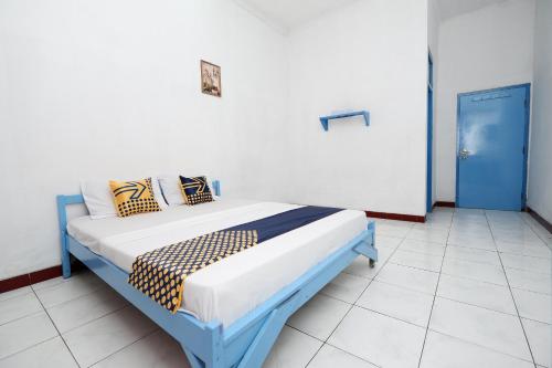 Imagen de la habitación del Hotel SPOT ON 2289 Saudara. Foto 9