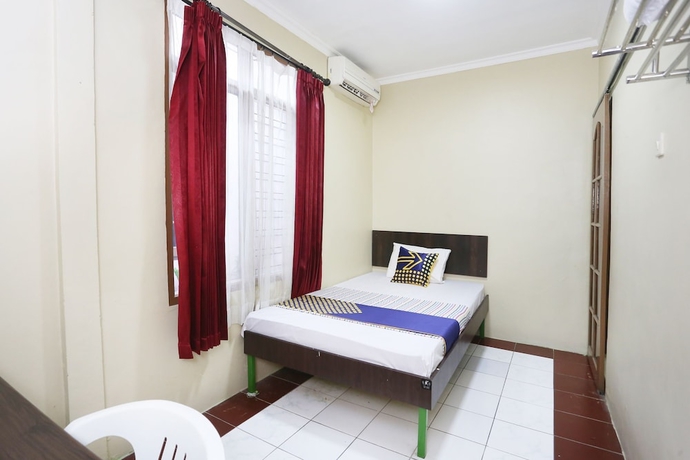 Imagen de la habitación del Hotel SPOT ON 2358 Aster Homestay. Foto 3