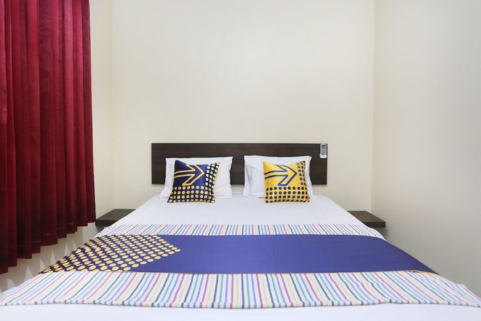 Imagen de la habitación del Hotel SPOT ON 2358 Aster Homestay. Foto 4