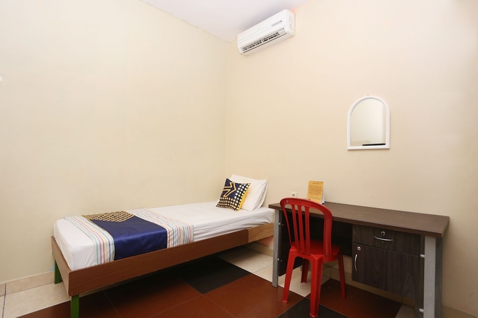 Imagen de la habitación del Hotel SPOT ON 2358 Aster Homestay. Foto 8