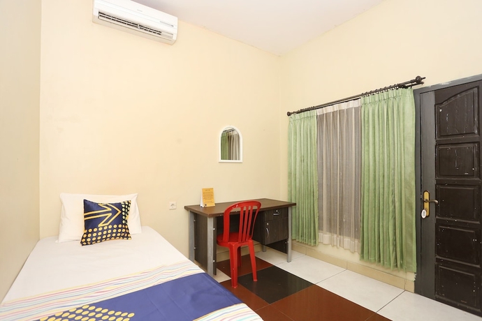 Imagen de la habitación del Hotel SPOT ON 2358 Aster Homestay. Foto 11