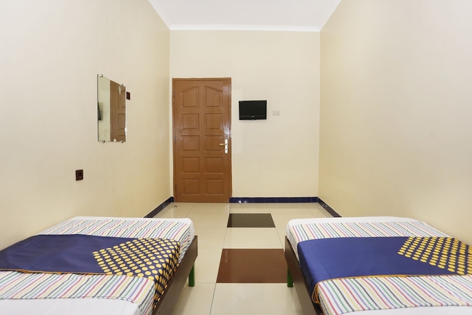 Imagen de la habitación del Hotel SPOT ON 2358 Aster Homestay. Foto 14