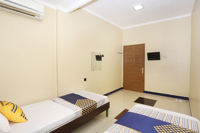 Imagen de la habitación del Hotel SPOT ON 2358 Aster Homestay. Foto 15