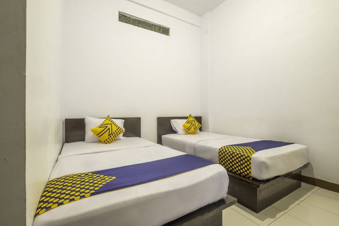 Imagen de la habitación del Hotel SPOT ON 2395 Aden 2 Syariah. Foto 9