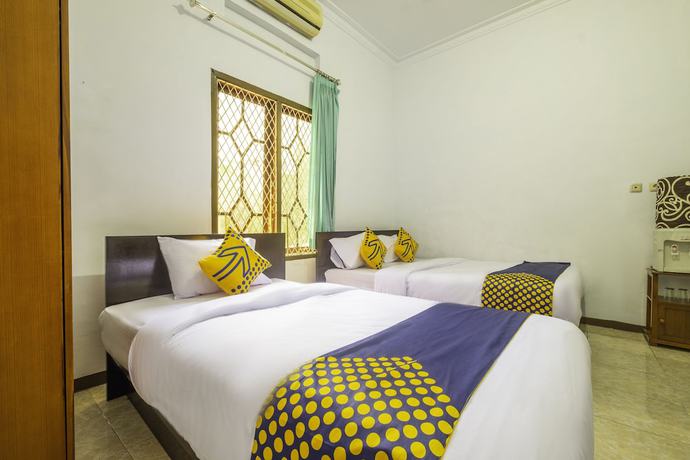 Imagen de la habitación del Hotel SPOT ON 2395 Aden 2 Syariah. Foto 12