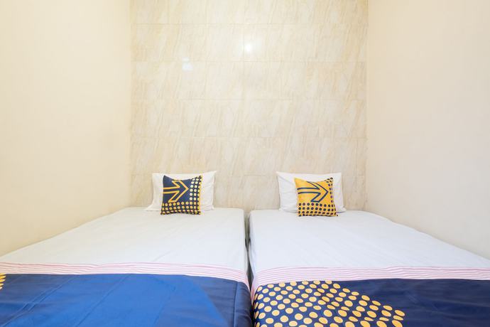 Imagen de la habitación del Hotel SPOT ON 2419 Rumah Nugraha Syariah. Foto 2