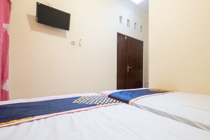 Imagen de la habitación del Hotel SPOT ON 2419 Rumah Nugraha Syariah. Foto 3