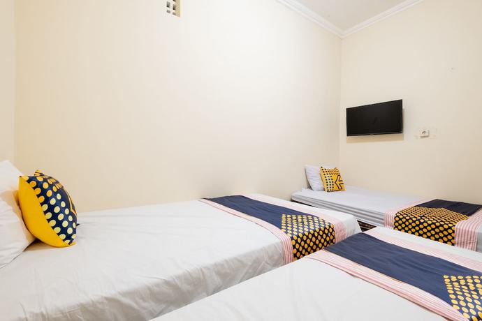 Imagen de la habitación del Hotel SPOT ON 2419 Rumah Nugraha Syariah. Foto 4