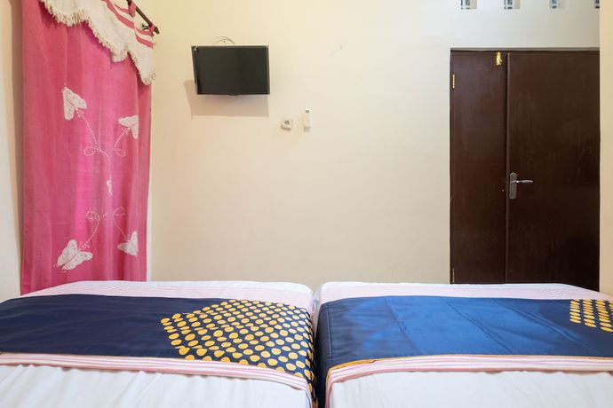 Imagen de la habitación del Hotel SPOT ON 2419 Rumah Nugraha Syariah. Foto 5