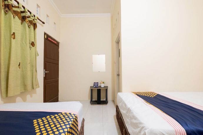 Imagen de la habitación del Hotel SPOT ON 2419 Rumah Nugraha Syariah. Foto 6