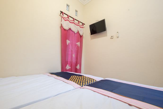 Imagen de la habitación del Hotel SPOT ON 2419 Rumah Nugraha Syariah. Foto 7