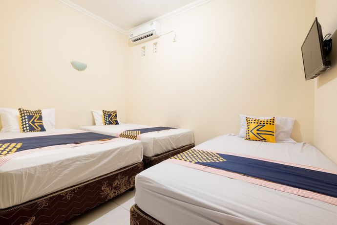 Imagen de la habitación del Hotel SPOT ON 2419 Rumah Nugraha Syariah. Foto 8