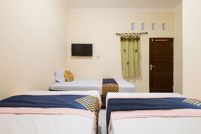 Imagen de la habitación del Hotel SPOT ON 2419 Rumah Nugraha Syariah. Foto 9