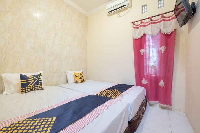 Imagen de la habitación del Hotel SPOT ON 2419 Rumah Nugraha Syariah. Foto 10