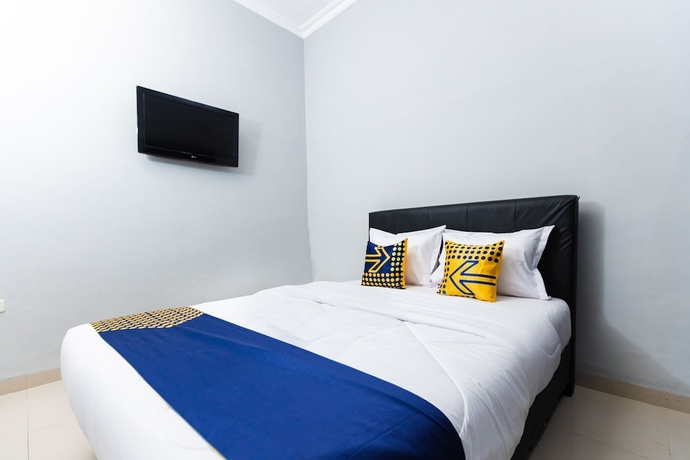Imagen de la habitación del Hotel SPOT ON 2433 Pondok Akuanna. Foto 5