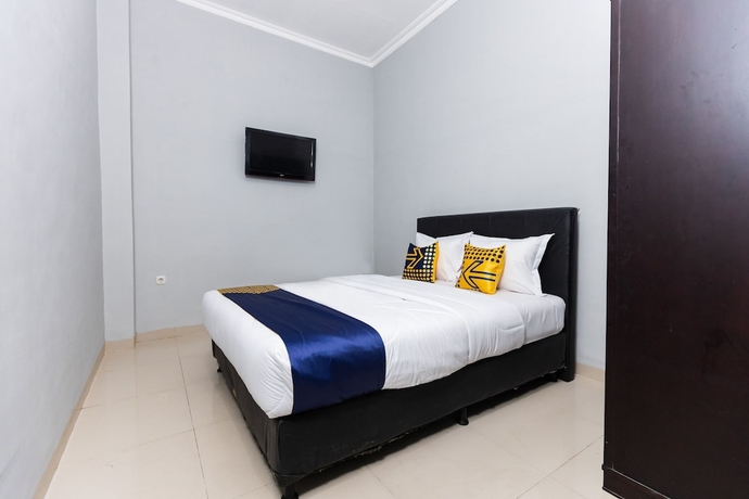 Imagen de la habitación del Hotel SPOT ON 2433 Pondok Akuanna. Foto 7