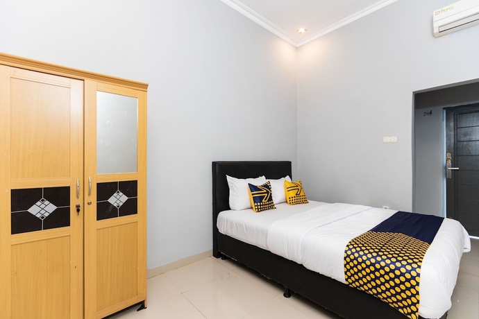 Imagen de la habitación del Hotel SPOT ON 2433 Pondok Akuanna. Foto 9