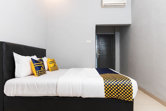 Imagen de la habitación del Hotel SPOT ON 2433 Pondok Akuanna. Foto 10