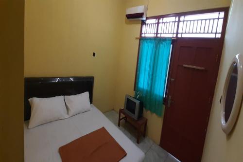 Imagen de la habitación del Hotel SPOT ON 2546 Griya Widya Syariah. Foto 10