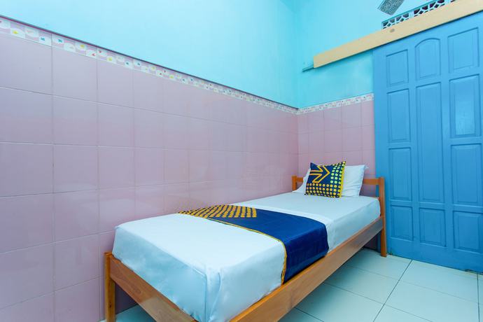 Imagen de la habitación del Hotel SPOT ON 2871 Budi. Foto 2