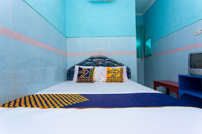 Imagen de la habitación del Hotel SPOT ON 2871 Budi. Foto 4