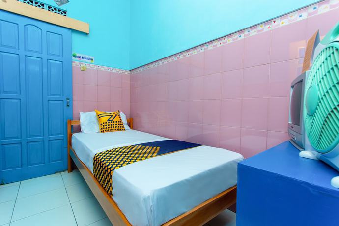 Imagen de la habitación del Hotel SPOT ON 2871 Budi. Foto 9