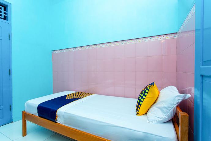 Imagen de la habitación del Hotel SPOT ON 2871 Budi. Foto 10