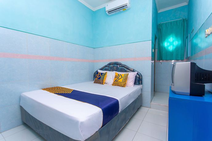 Imagen de la habitación del Hotel SPOT ON 2871 Budi. Foto 13