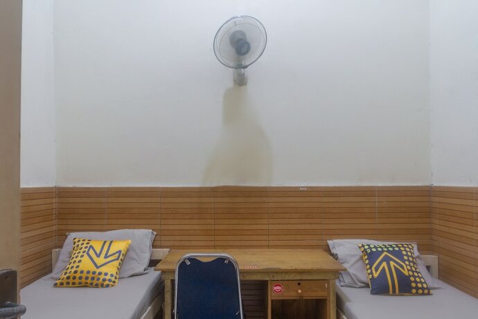 Imagen de la habitación del Hotel SPOT ON 3155 Penginapan Banyu Biru Syariah. Foto 11