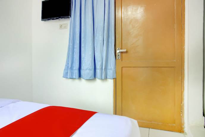 Imagen de la habitación del Hotel SPOT ON 3286 Ramania Residence Syariah. Foto 3