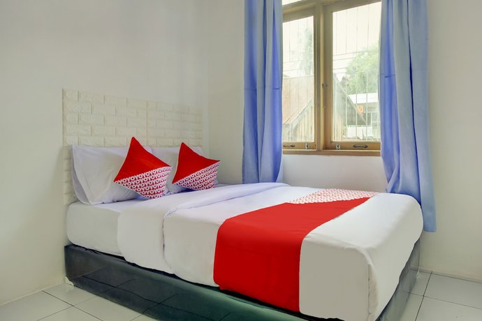 Imagen de la habitación del Hotel SPOT ON 3286 Ramania Residence Syariah. Foto 5