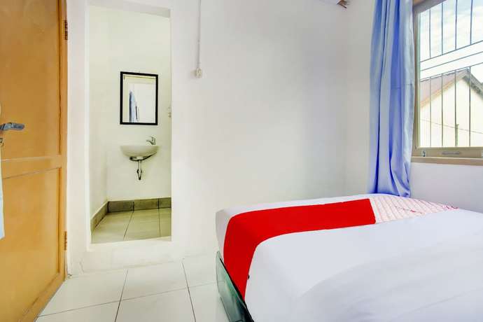 Imagen de la habitación del Hotel SPOT ON 3286 Ramania Residence Syariah. Foto 6
