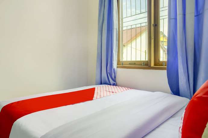 Imagen de la habitación del Hotel SPOT ON 3286 Ramania Residence Syariah. Foto 9